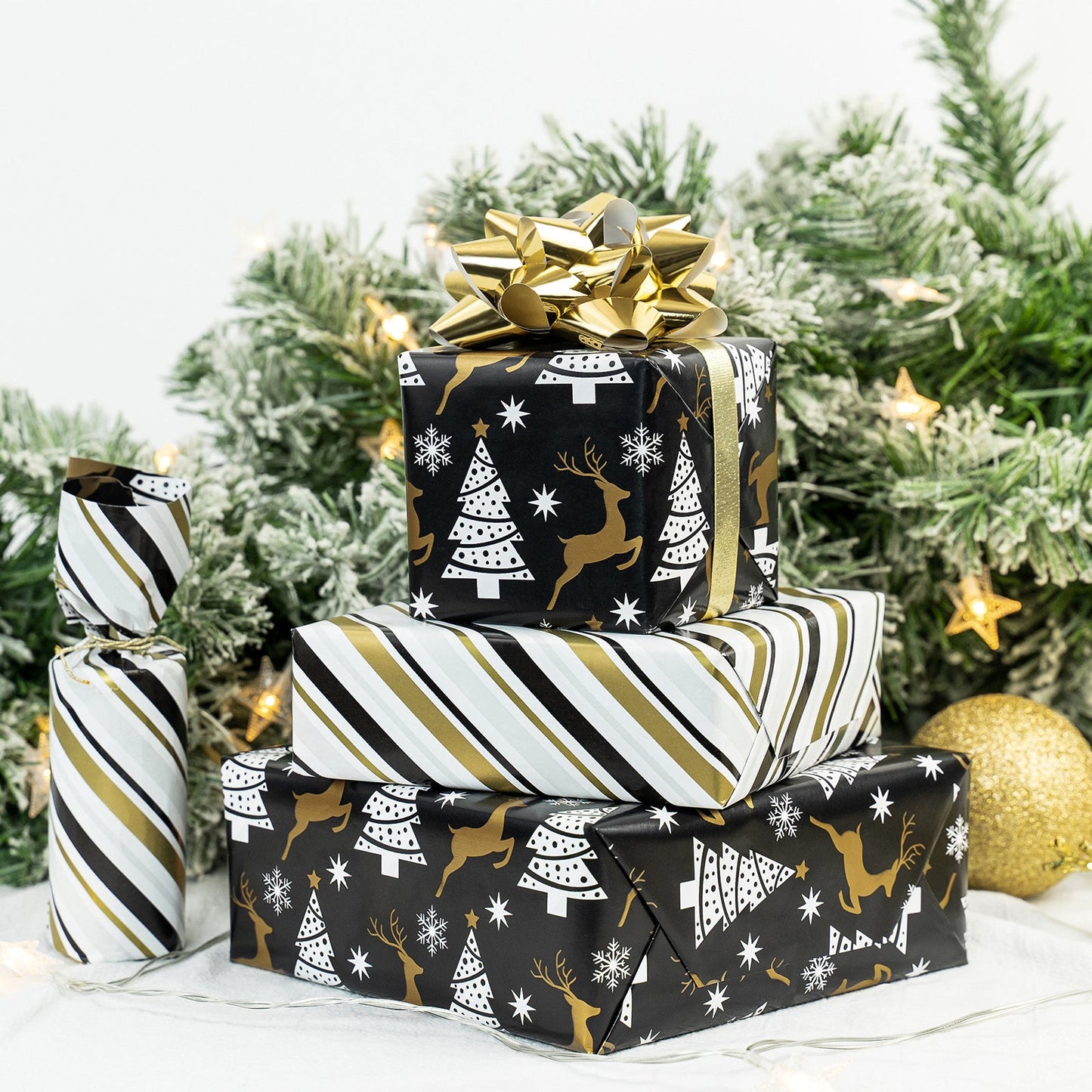 Black Reindeer Christmas Wrapping Paper Roll with Brown & Light Blue Diagonal Stripes on Reverse