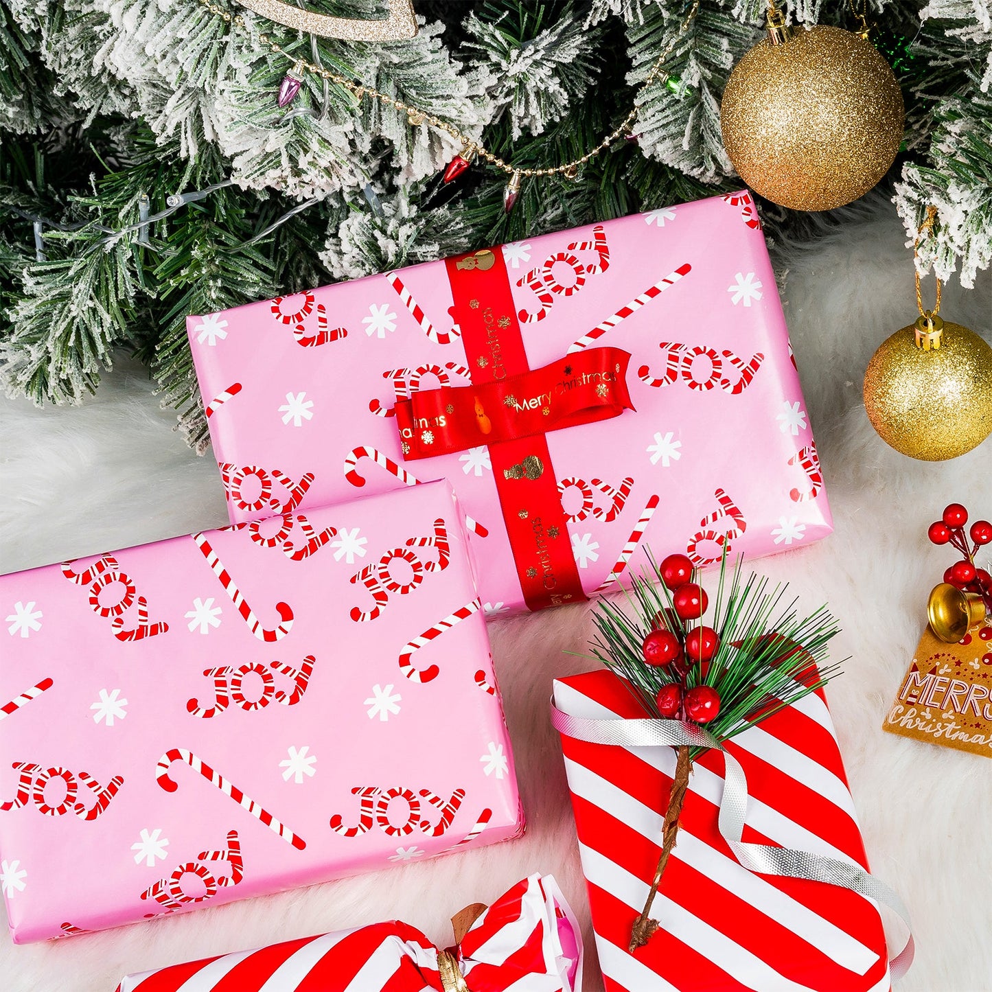 Pink Joy Candy Christmas Wrapping Paper Roll with Red & White Diagonal Stripes on Reverse